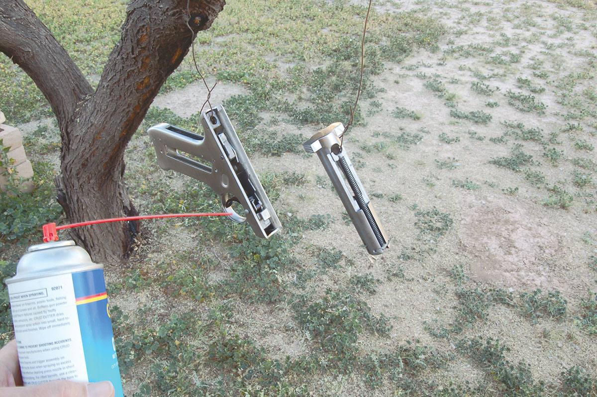Hang subassemblies on a wire (if gun is disassembled) and spray liberally with modern one-shot cleaner/lubricant.